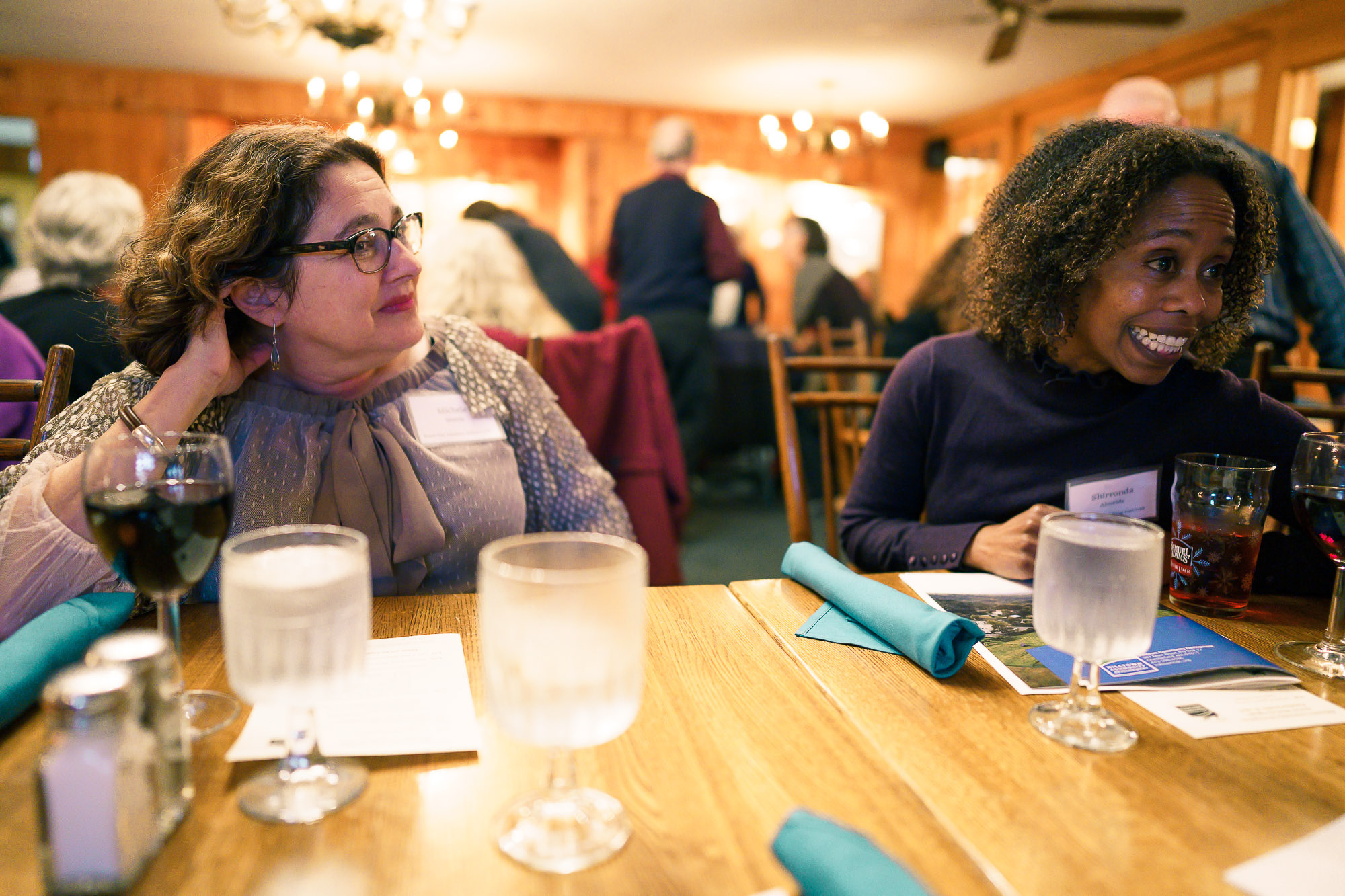 CDC board member Michele Morris listens as a guest tells a story.